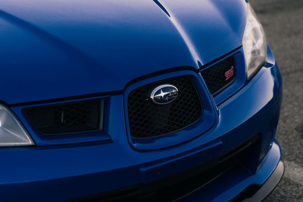 subaru, auto repair in Arcata, CA at North Bay Automotive. Image of the front grille of a blue Subaru STI, showcasing the shop’s expertise in Subaru maintenance and performance care.
