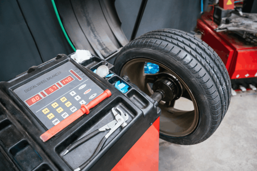 Tire rotation and balancing, auto repair in Arcata, CA by North Bay Automotive. Image of a tire mounted on a digital wheel balancer, highlighting precise balancing, reduced vibration, extended tire life, and smoother, safer driving performance.